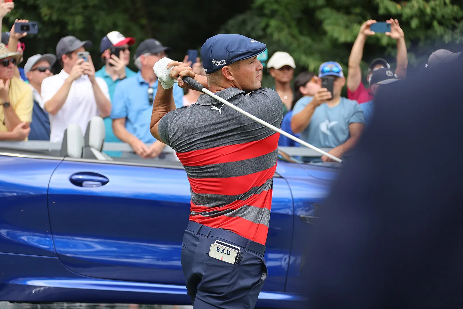 Spectators watching play at a professional golf tournament
