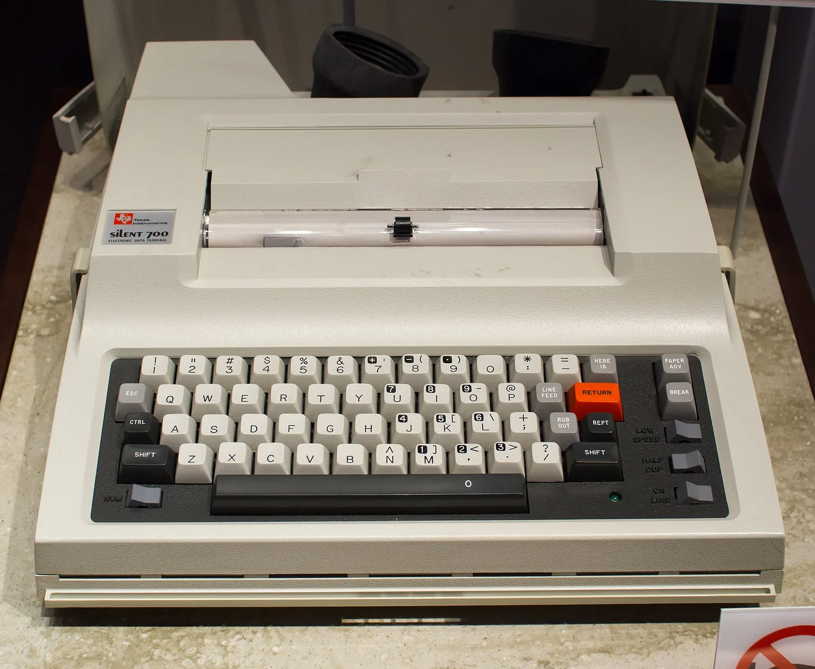 A Texas Instruments Silent 700 computer terminal from 1971, the kind of portable terminal used to dial into early online services
