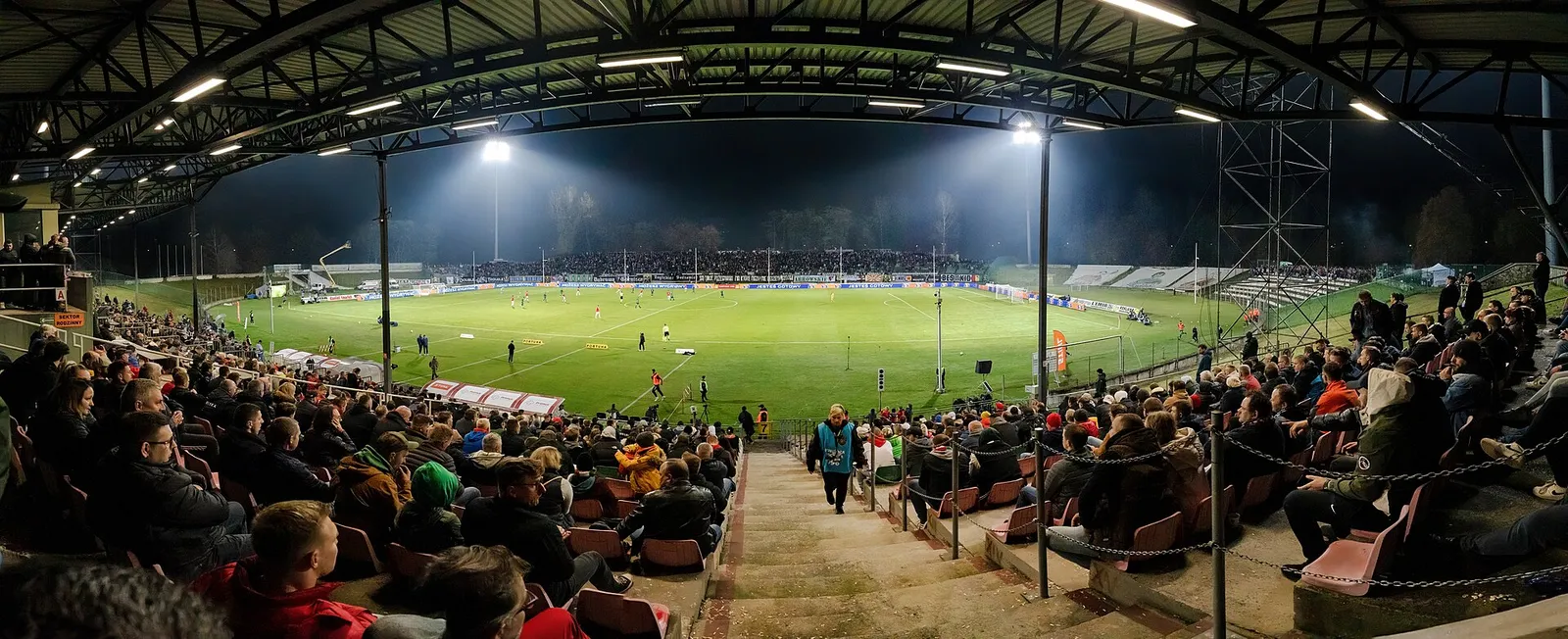 A football match under floodlights (illustrative)