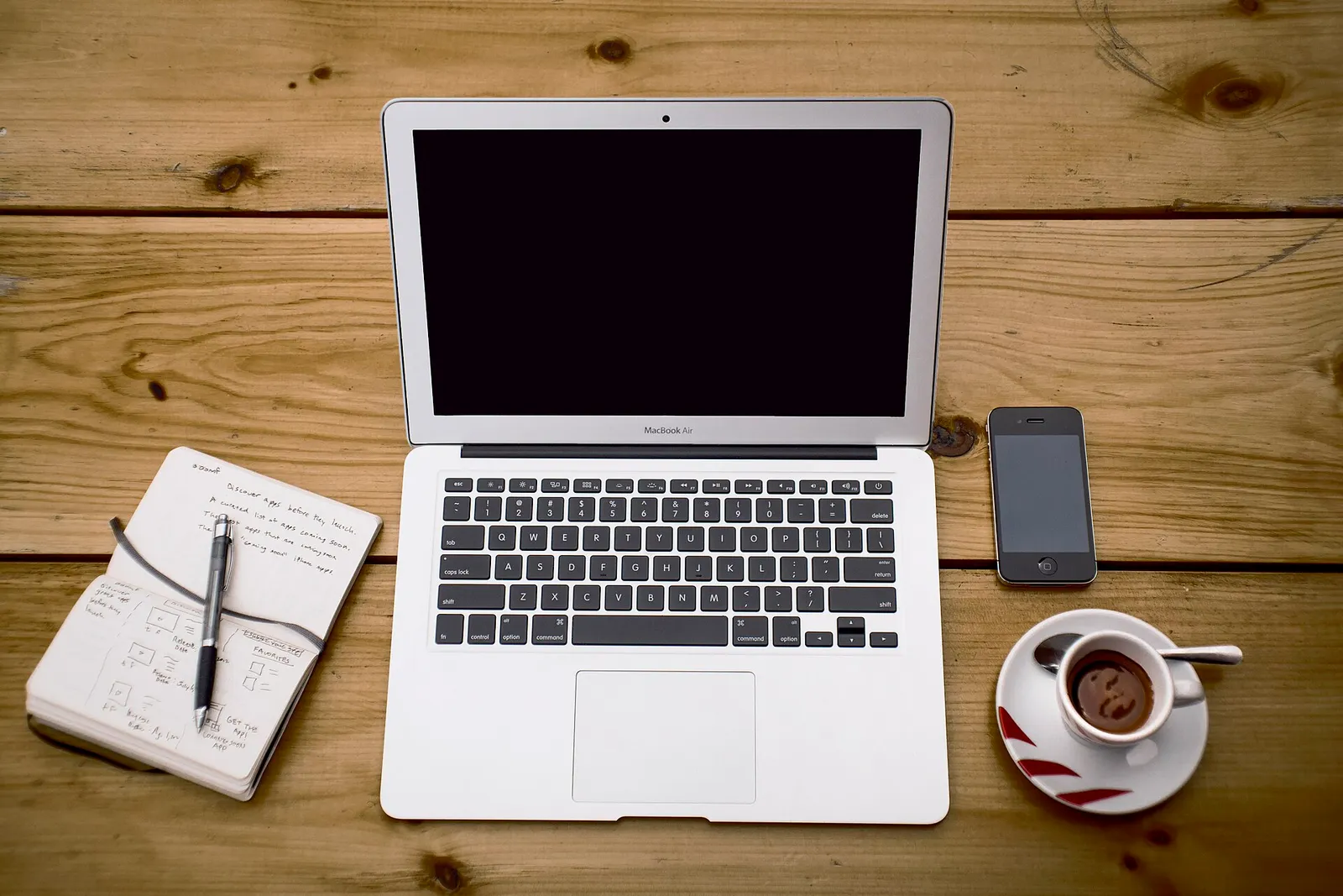Phones and a laptop on a table
