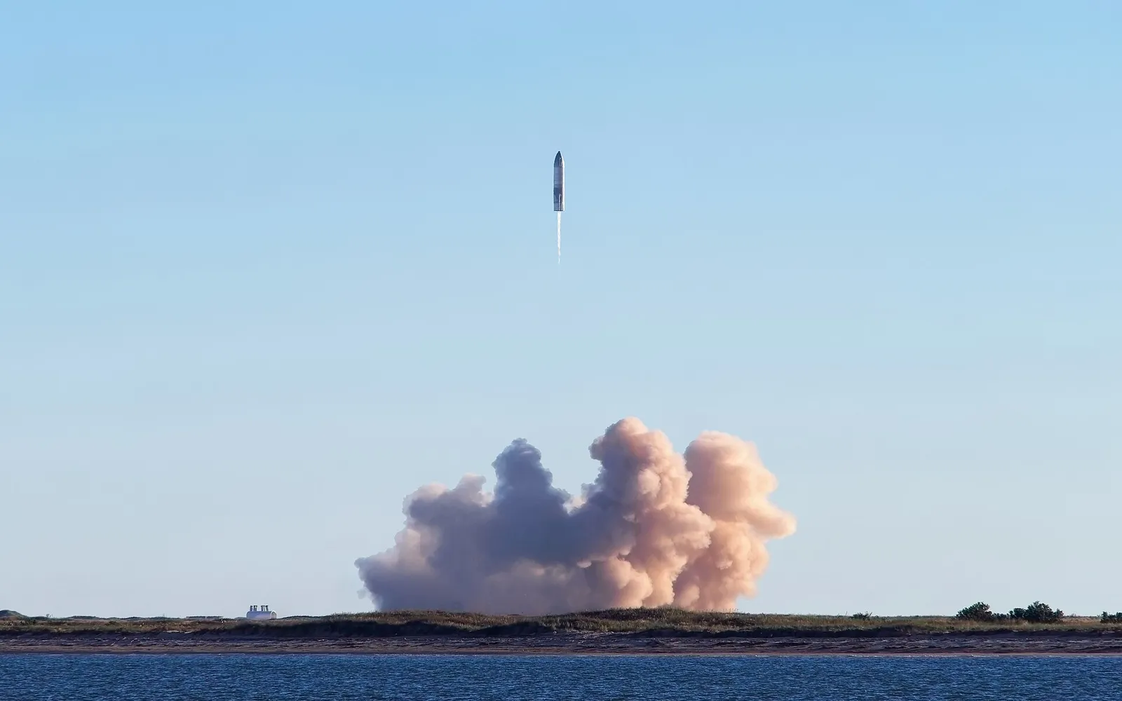 A SpaceX Starship prototype climbing away from the Texas coast