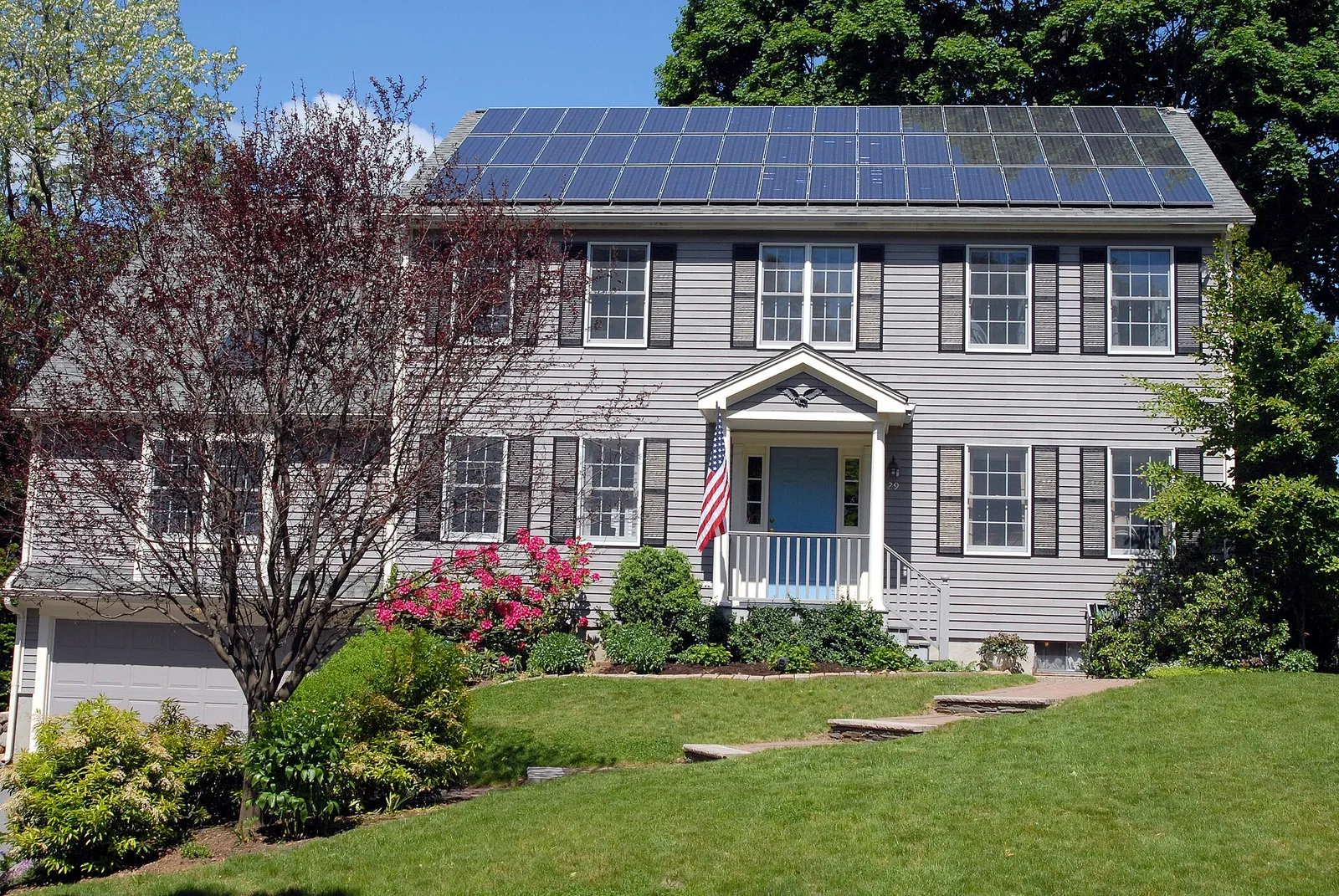 Conventional solar panels mounted on a house roof