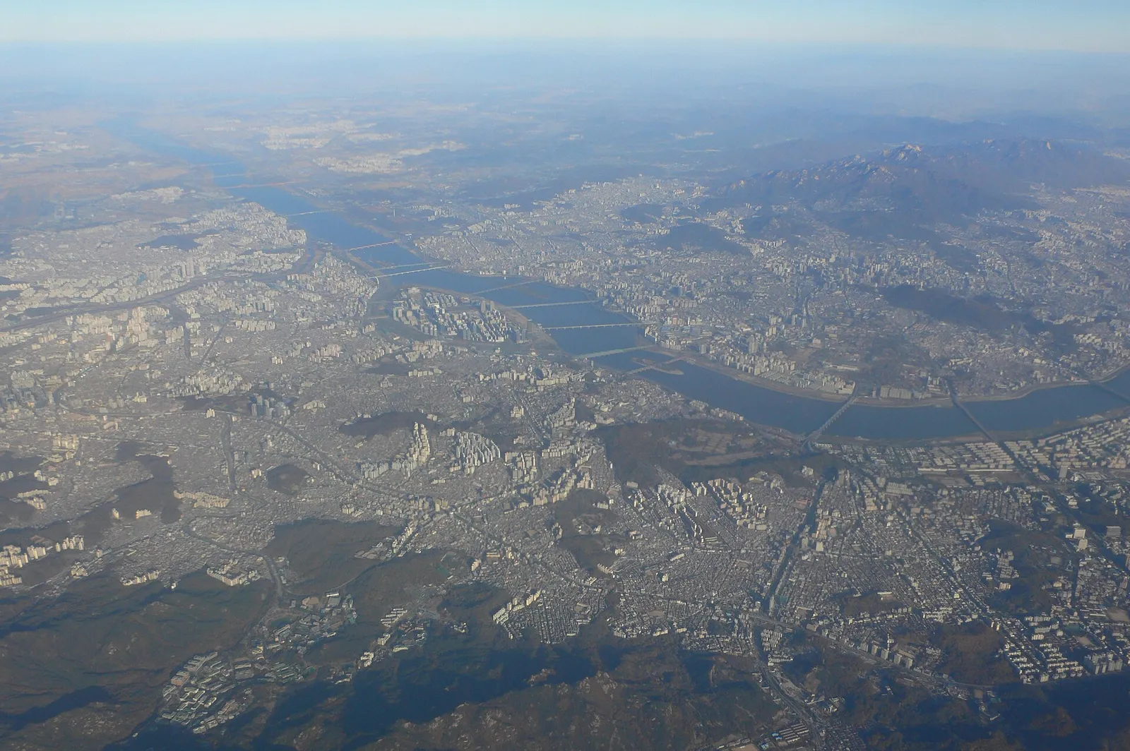 The Seoul cityscape along the Han River (illustrative)