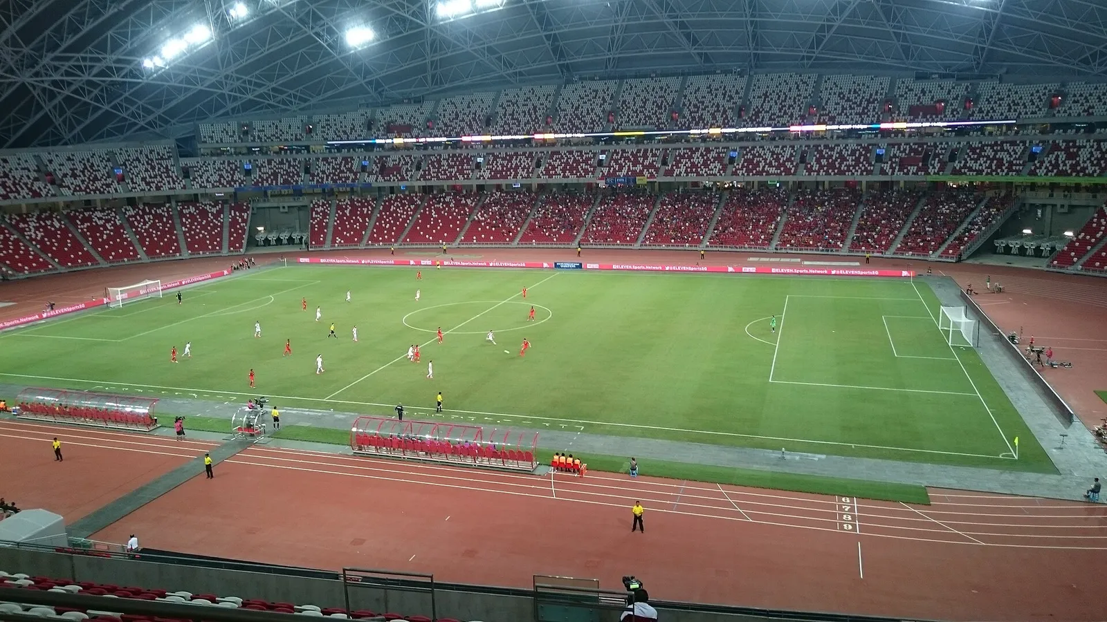 A soccer match in a stadium (illustrative)