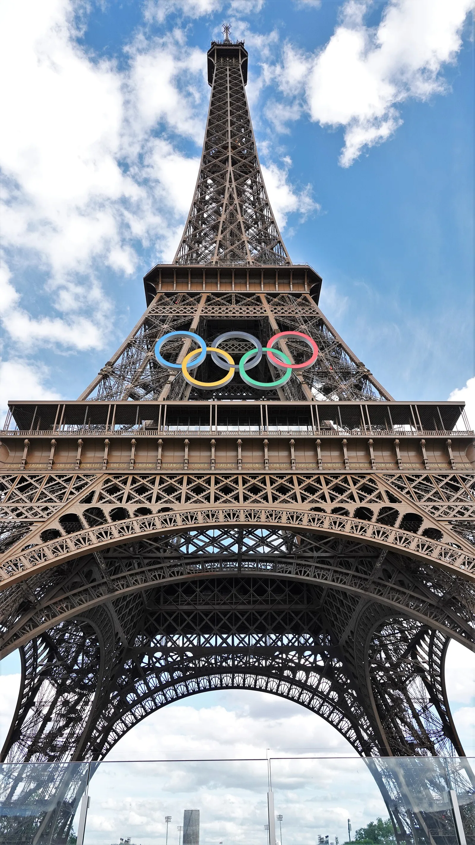 The Eiffel Tower in Paris under a clear summer sky