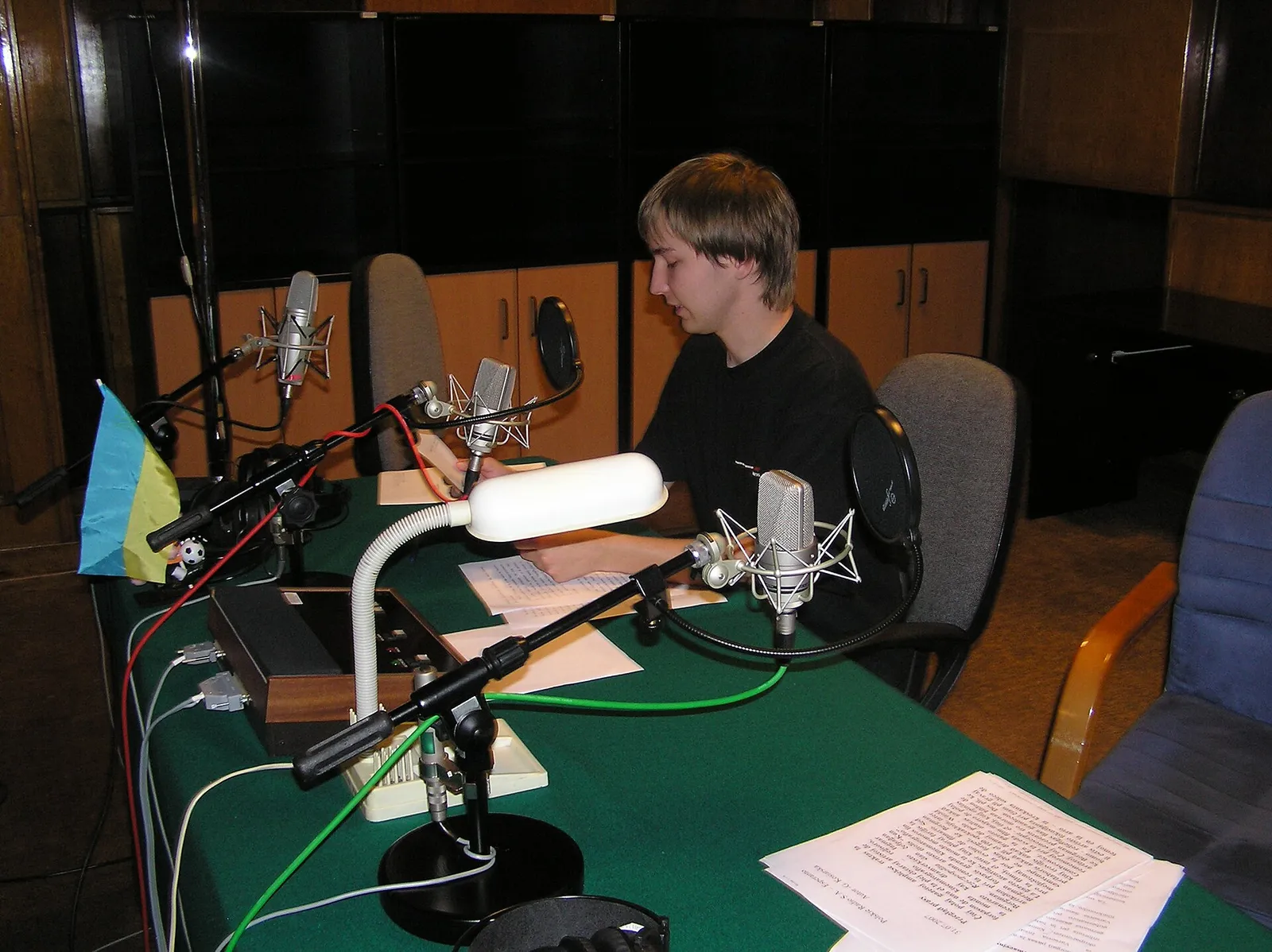 A radio studio with microphones and a mixing desk