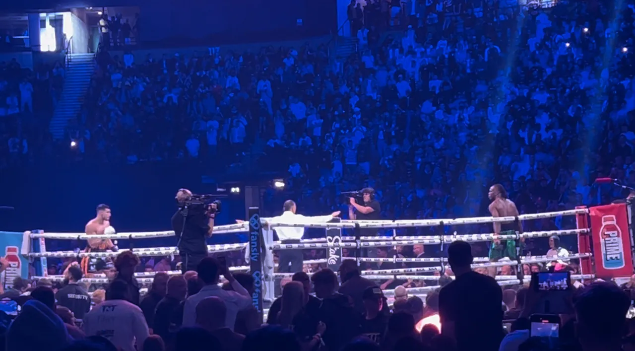 Two boxers during a match in the ring