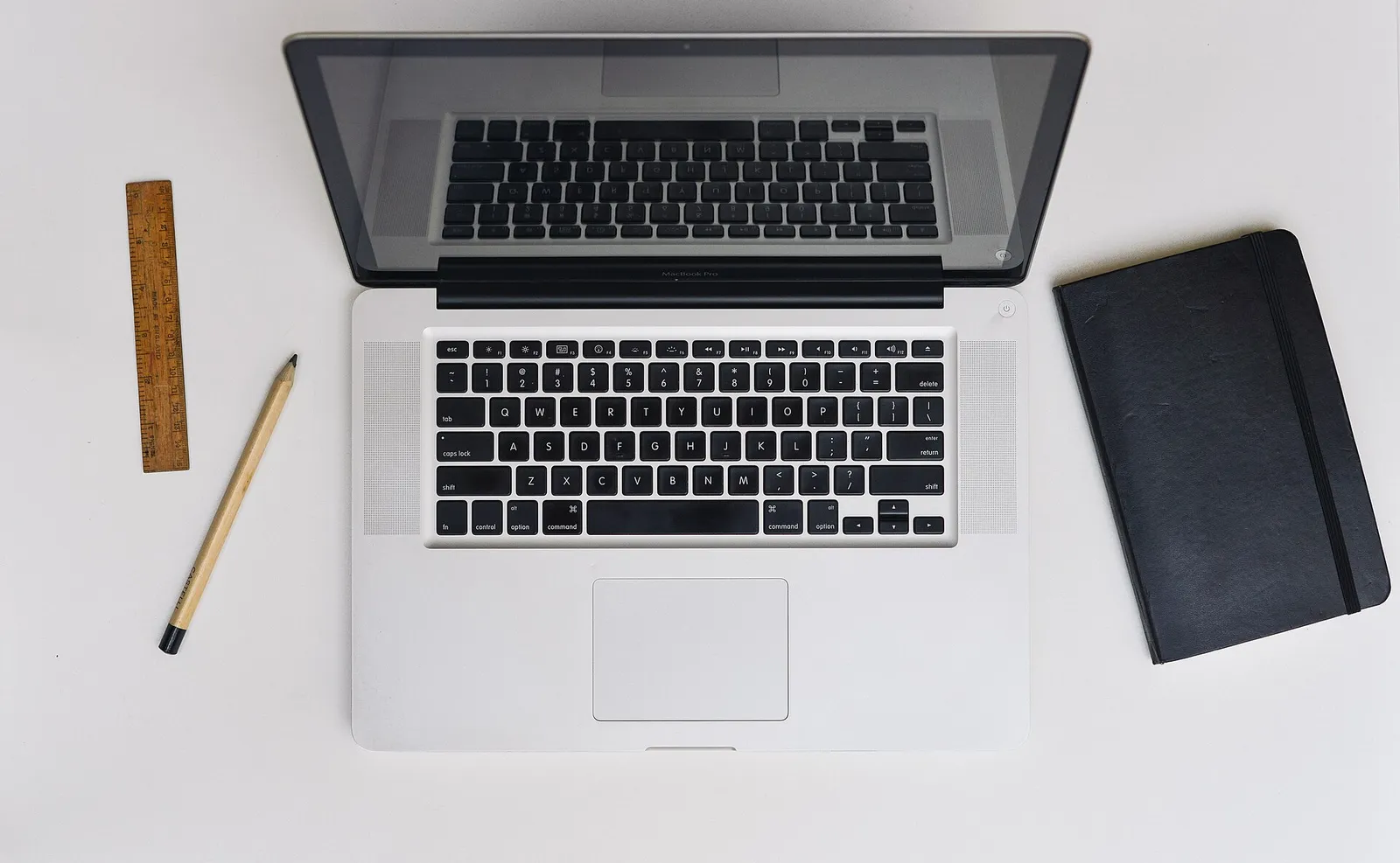 A MacBook laptop open on a desk