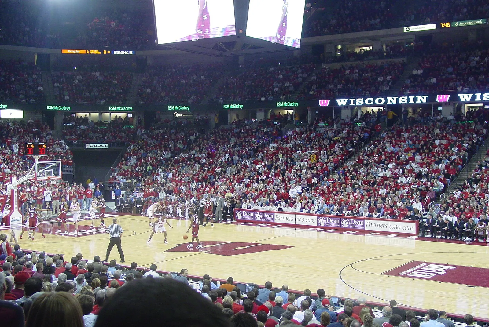 A basketball game in progress in a packed arena