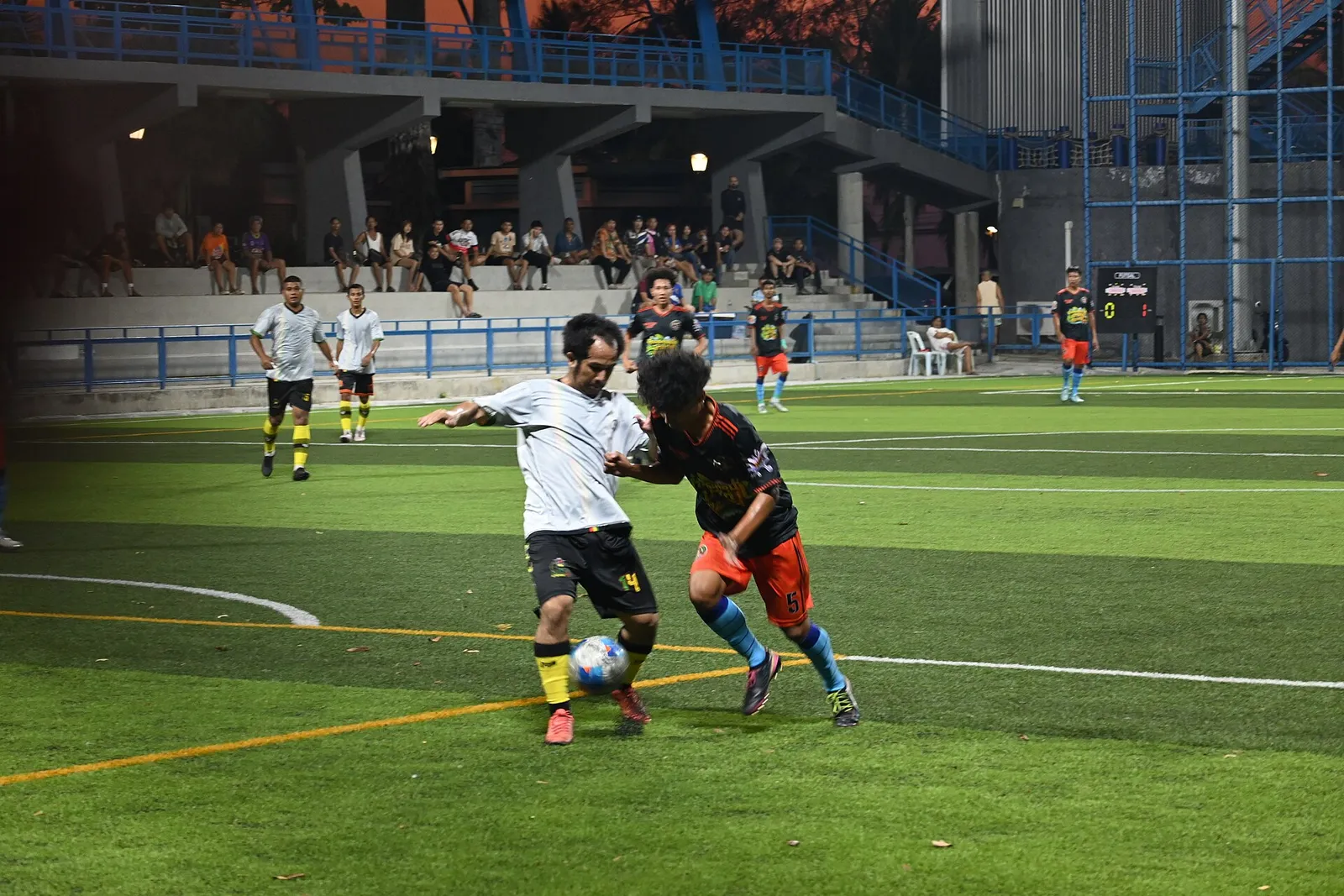Players compete for the ball in a football match (file image)