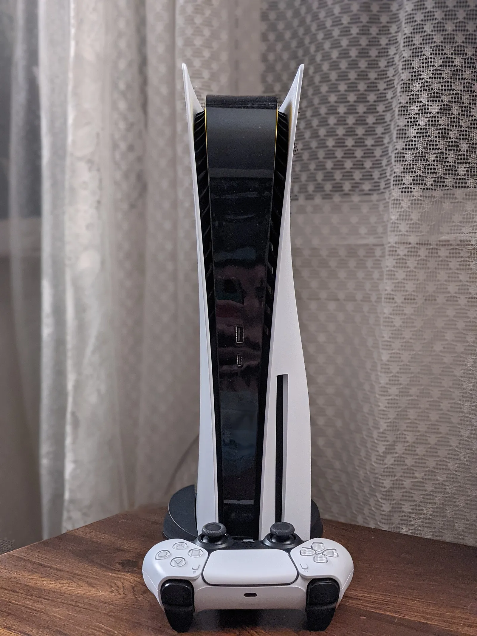 A PlayStation 5 console and its DualSense controller