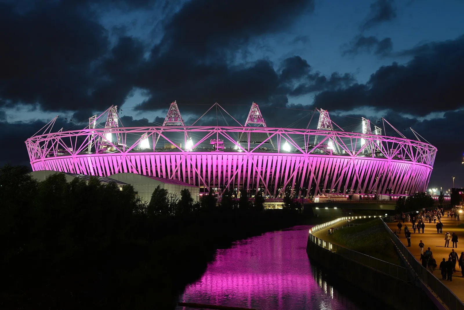 The London Stadium, formerly the Olympic Stadium, lit up at night during an athletics meeting