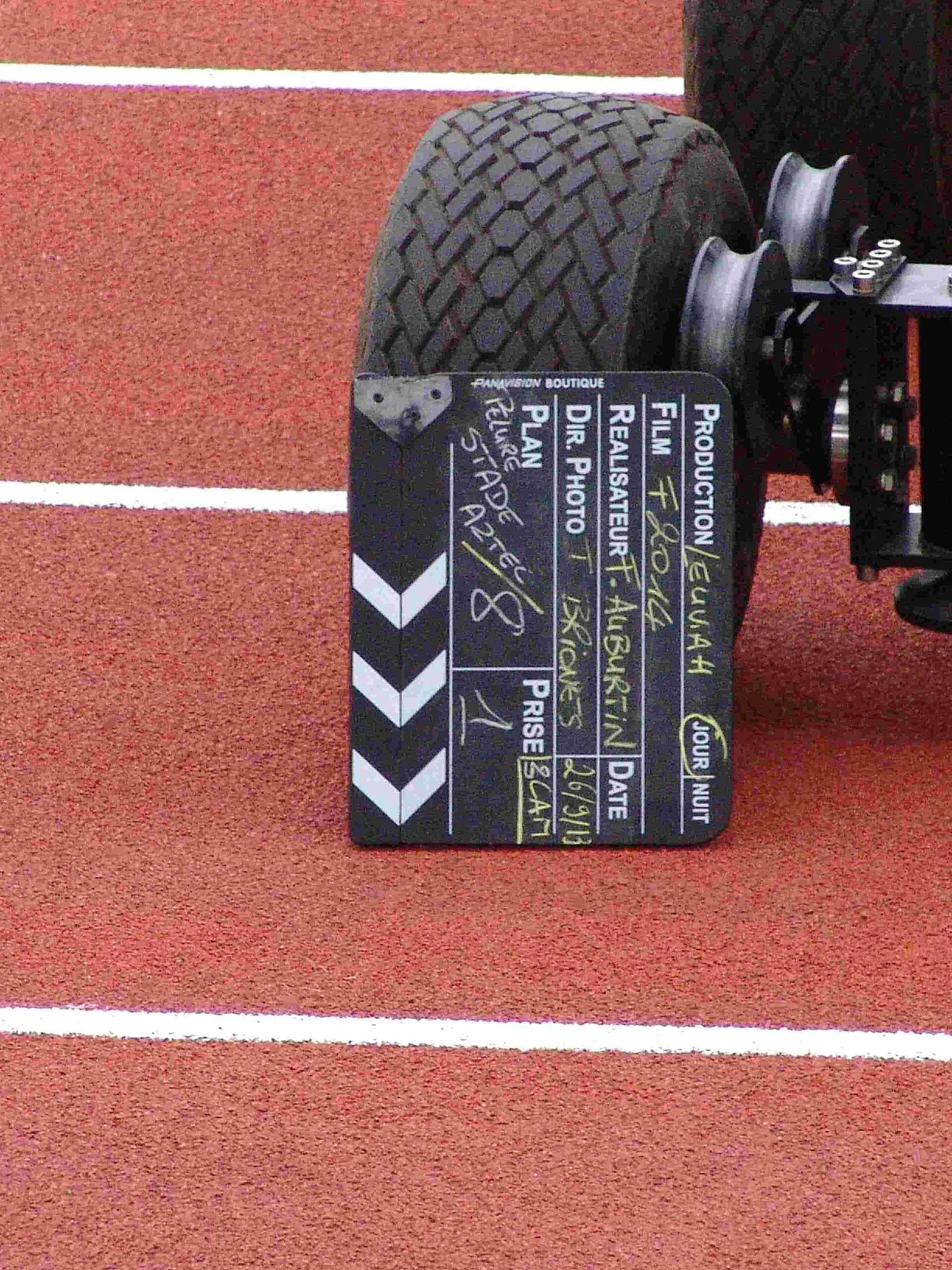 A film clapperboard on a production set (illustrative)