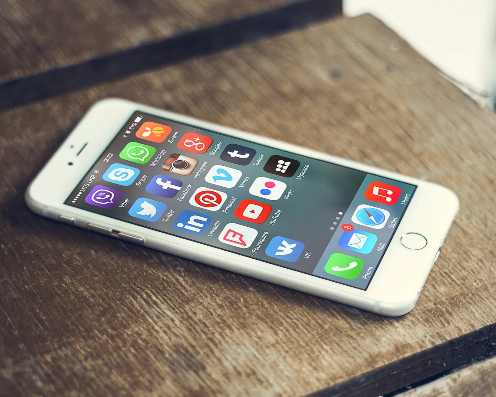 Social-media app icons on a smartphone screen (illustrative photograph)