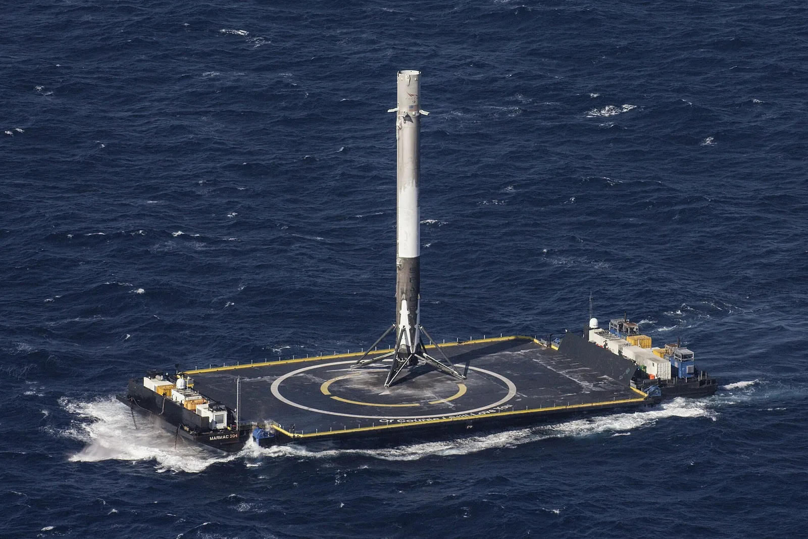 A SpaceX Falcon 9 booster after landing on a droneship at sea (file image)