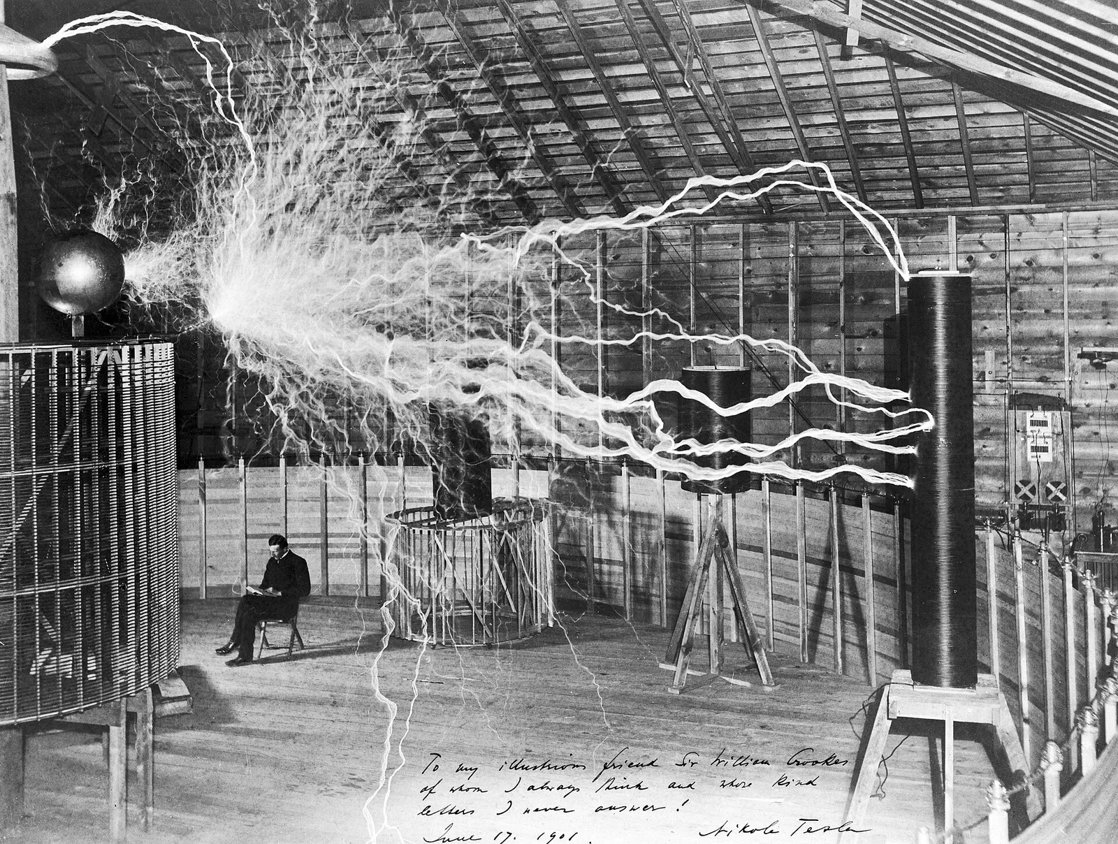 Nikola Tesla pictured with his high-voltage equipment (historical image)