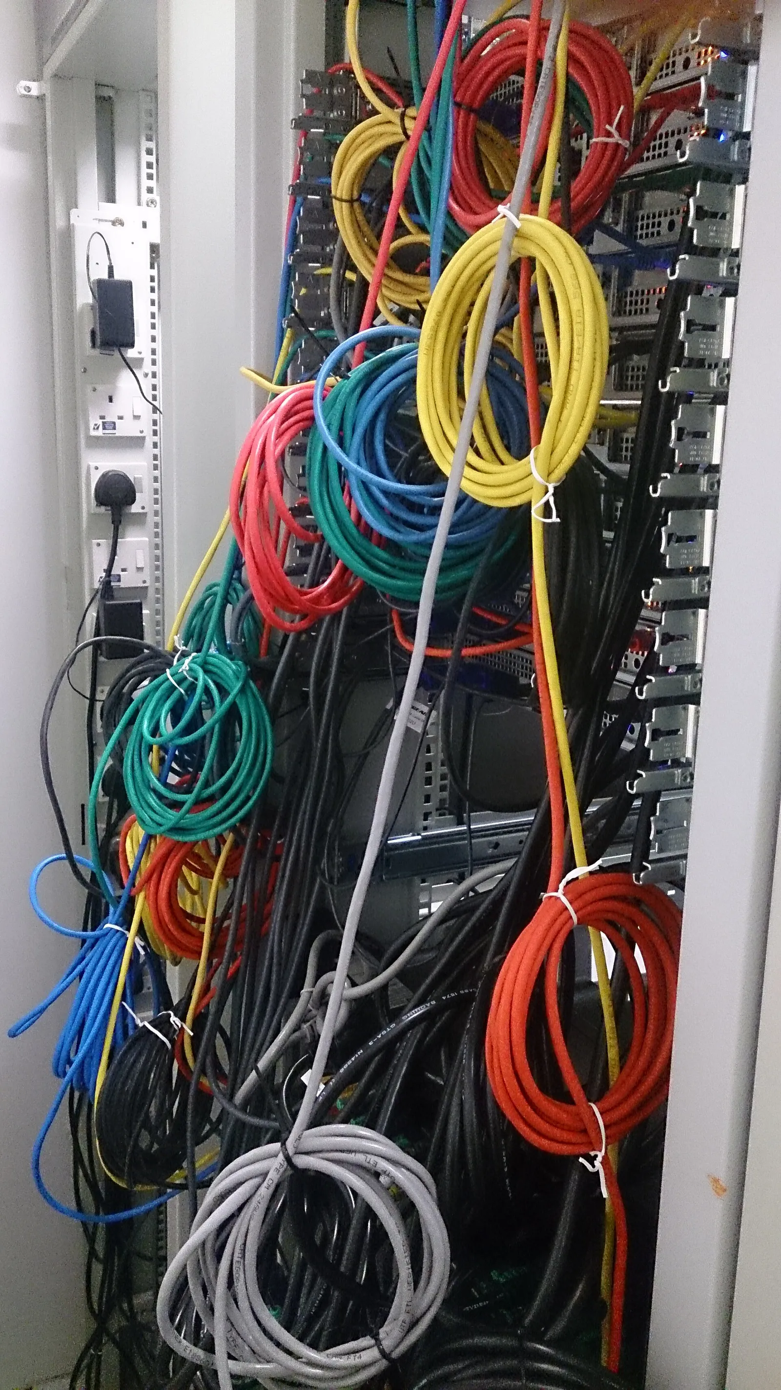 Network cables in a server room (illustrative)