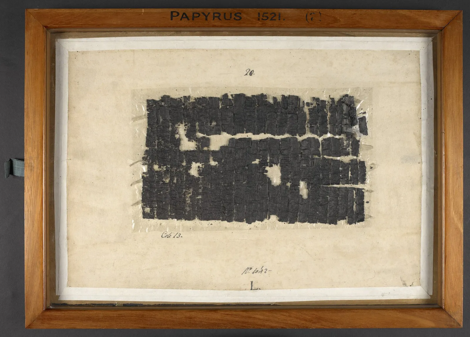 A Herculaneum papyrus fragment with visible ancient Greek text, held at the British Library