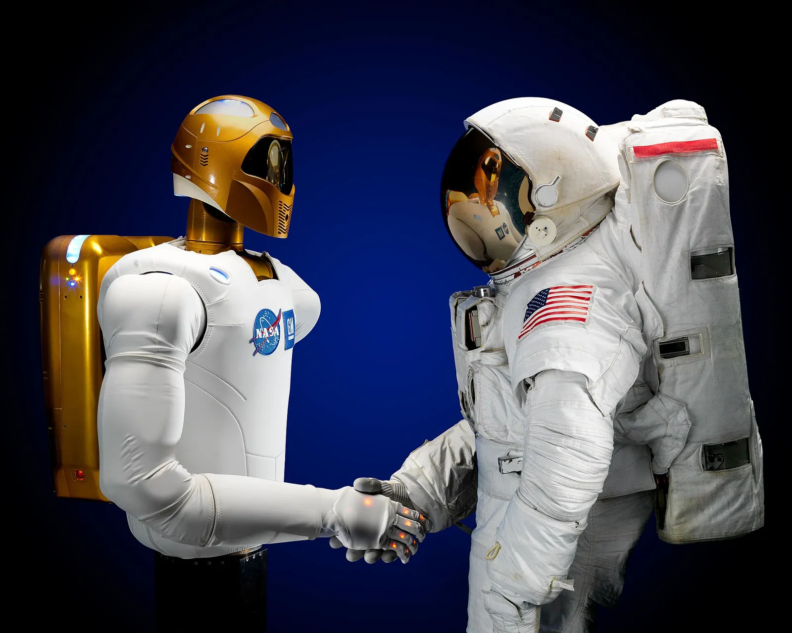 A robotic hand and a human hand (file image of NASA's Robonaut)