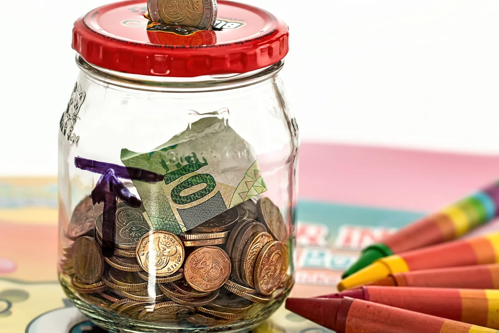 A piggy bank with coins (illustrative photograph)