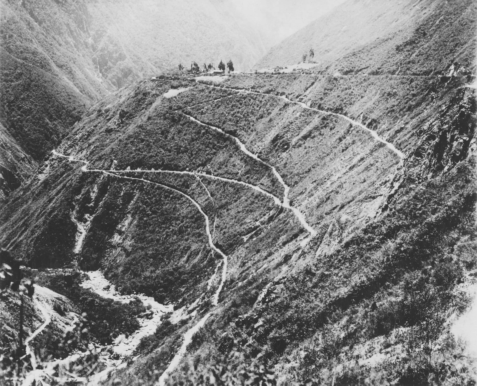 A mountain road cut into a steep slope in Peru