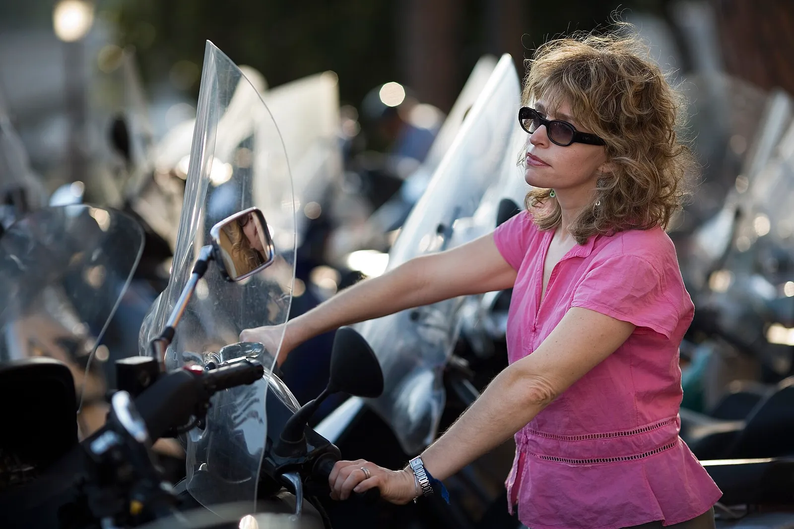 Vespa scooters parked on a street in Rome