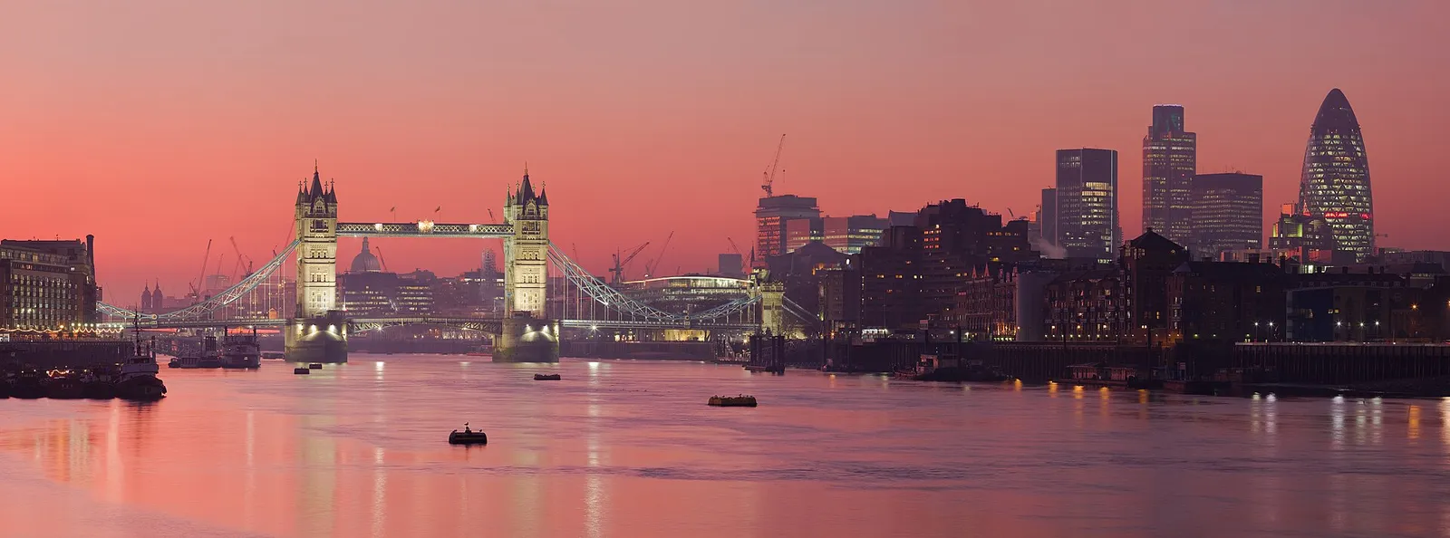 A warm, hazy sky over the River Thames and the London skyline