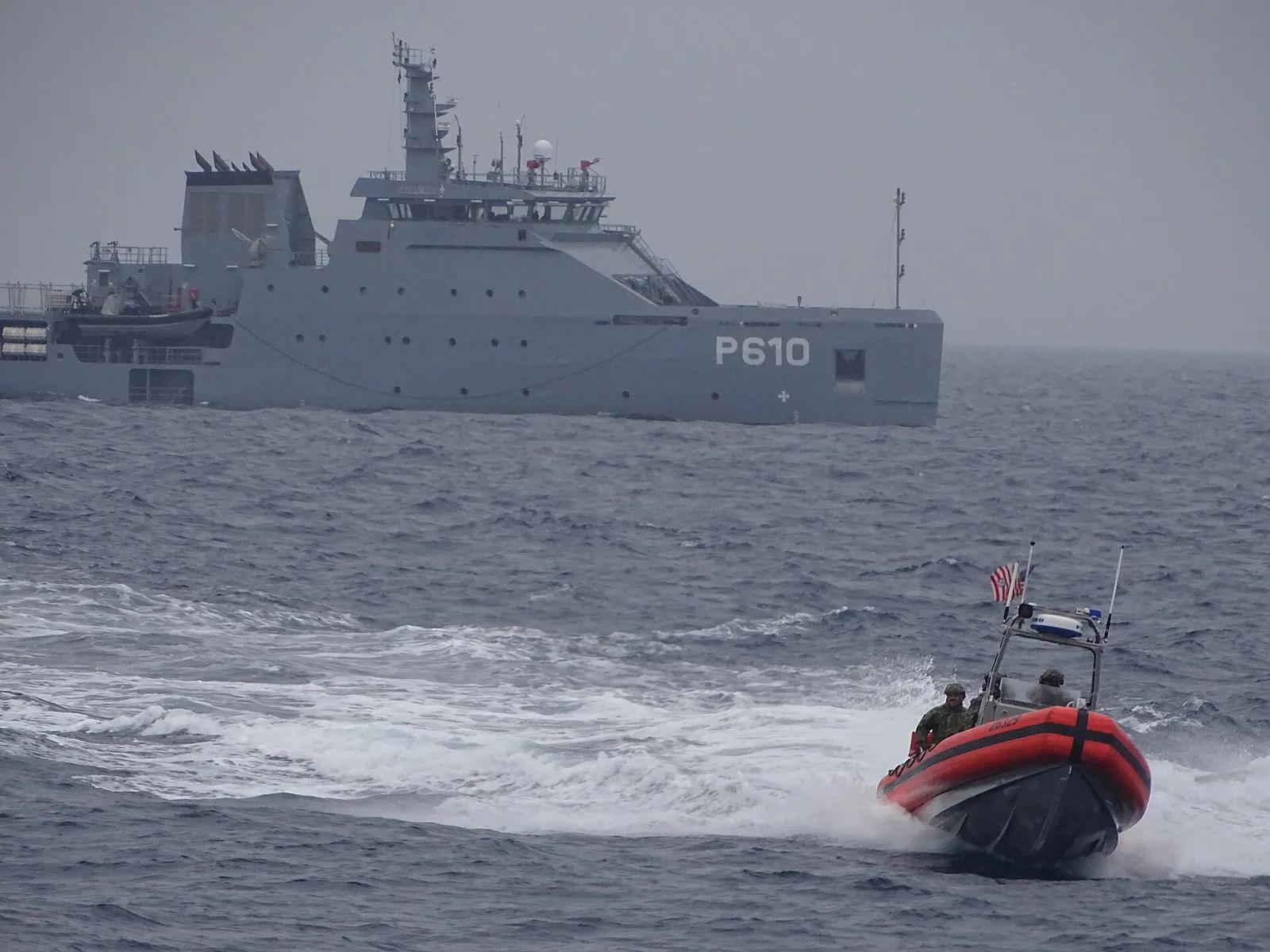The Tunisian navy vessel Jugurtha at sea, with a US Coast Guard boat alongside