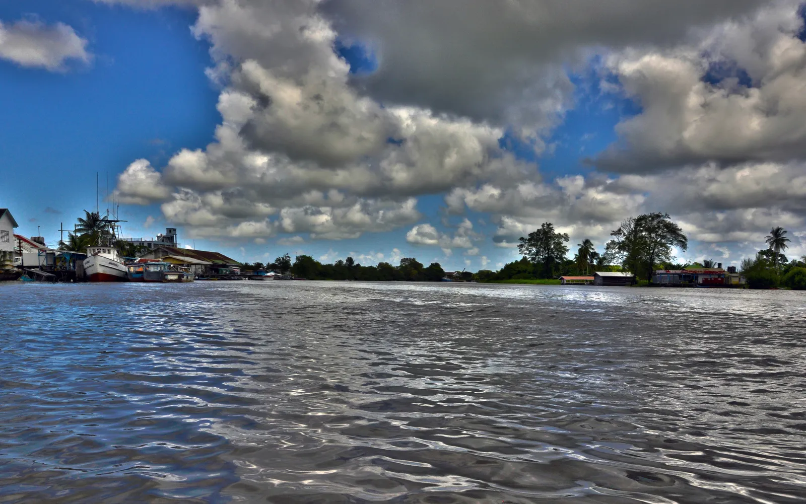 A river in Guyana, where boats provide transport to communities beyond the coastal strip
