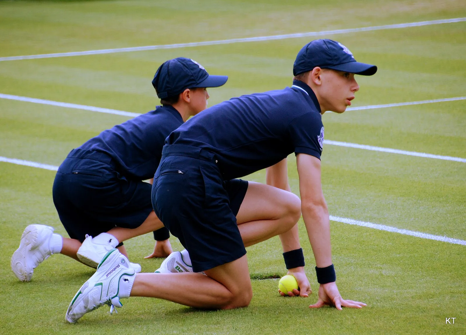 A tennis match on a grass court at Wimbledon (illustrative)