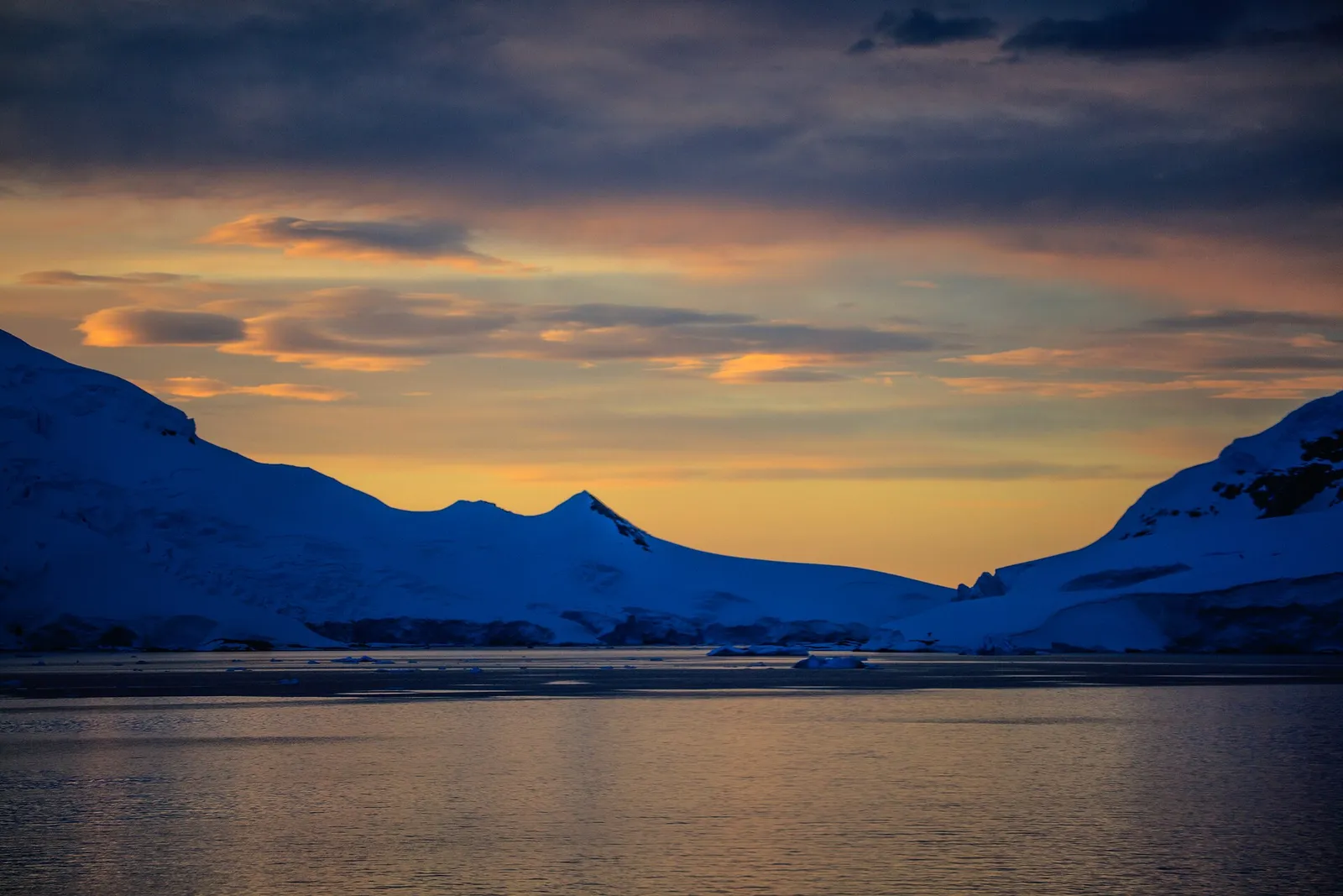 The sun low over the horizon near midnight at high latitude