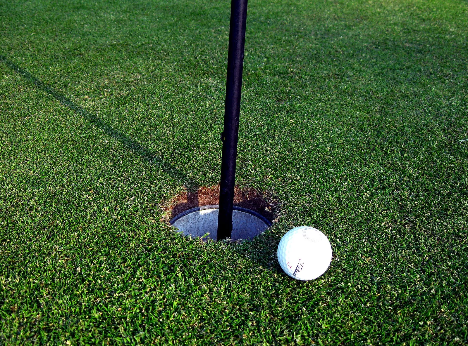 A golf ball on a course (illustrative)