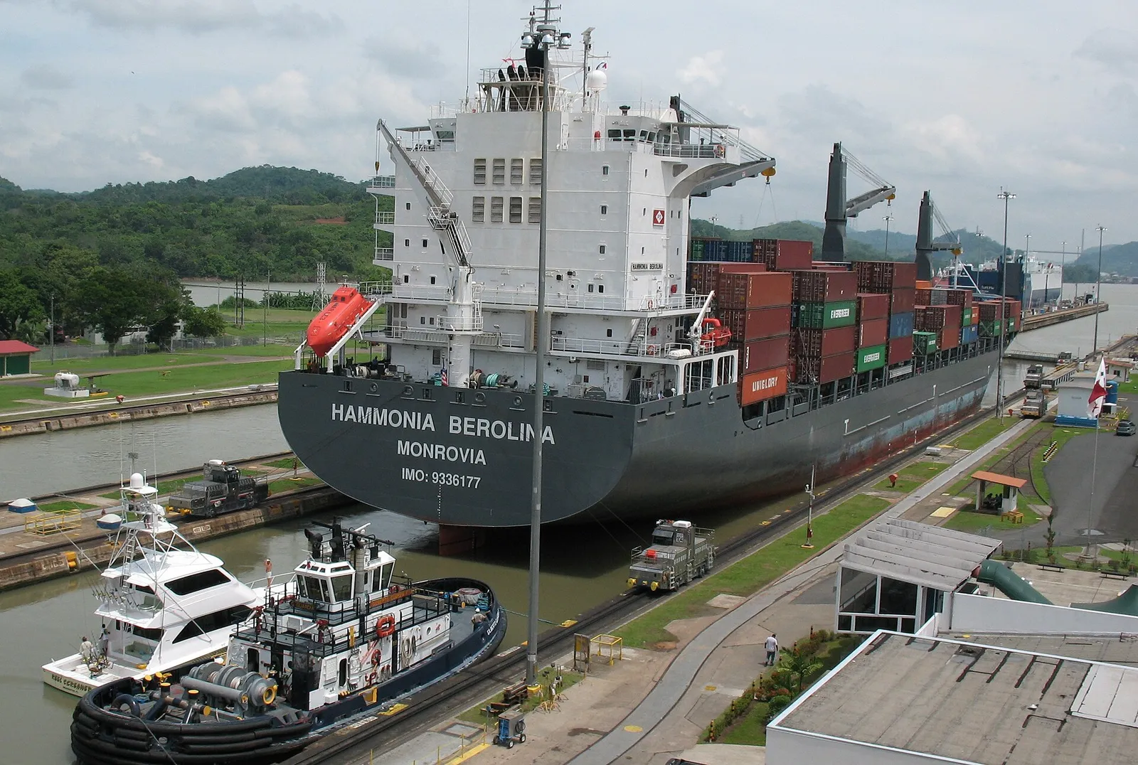 A ship under tow in the locks of the Panama Canal