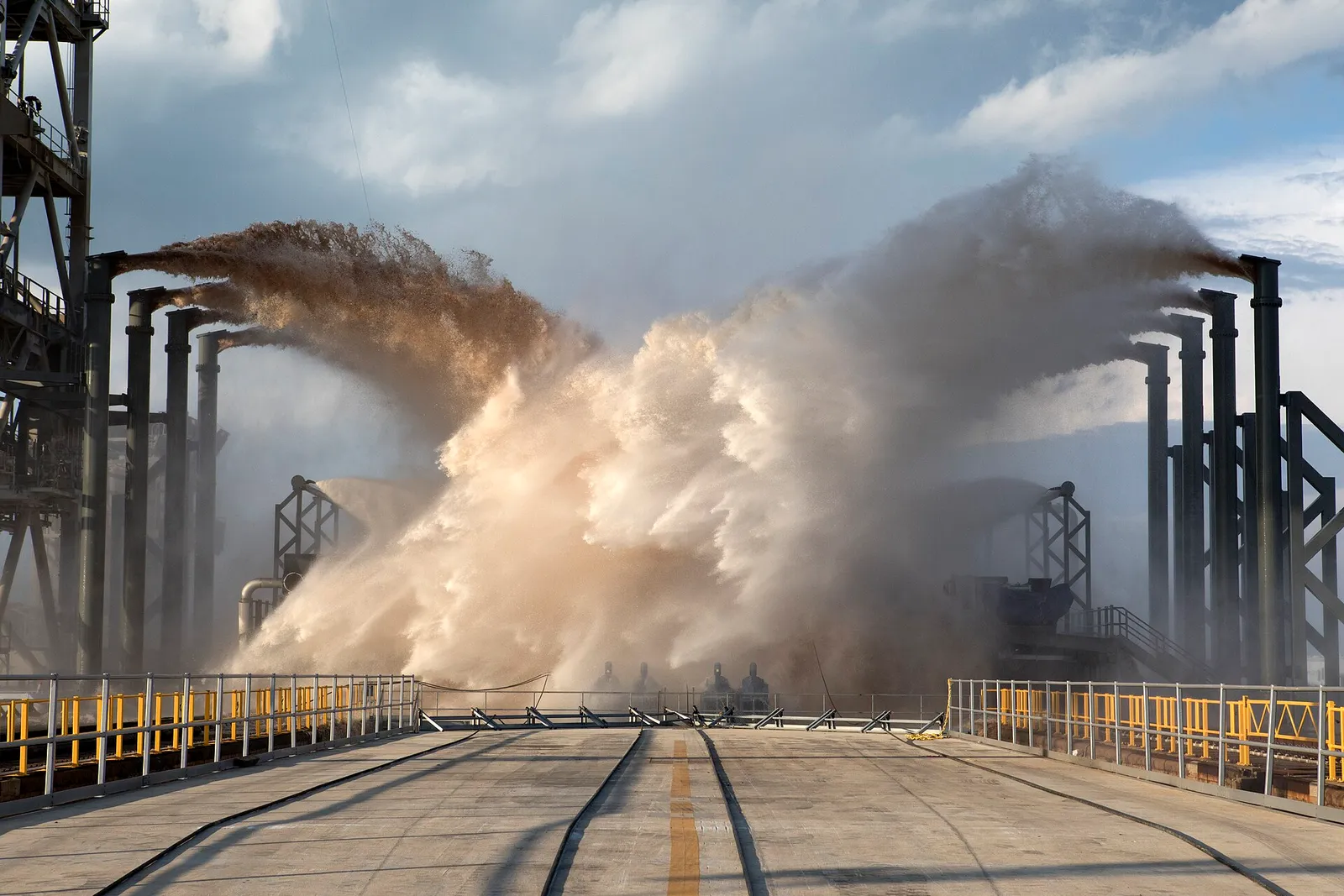 A SpaceX launch pad during a water deluge test