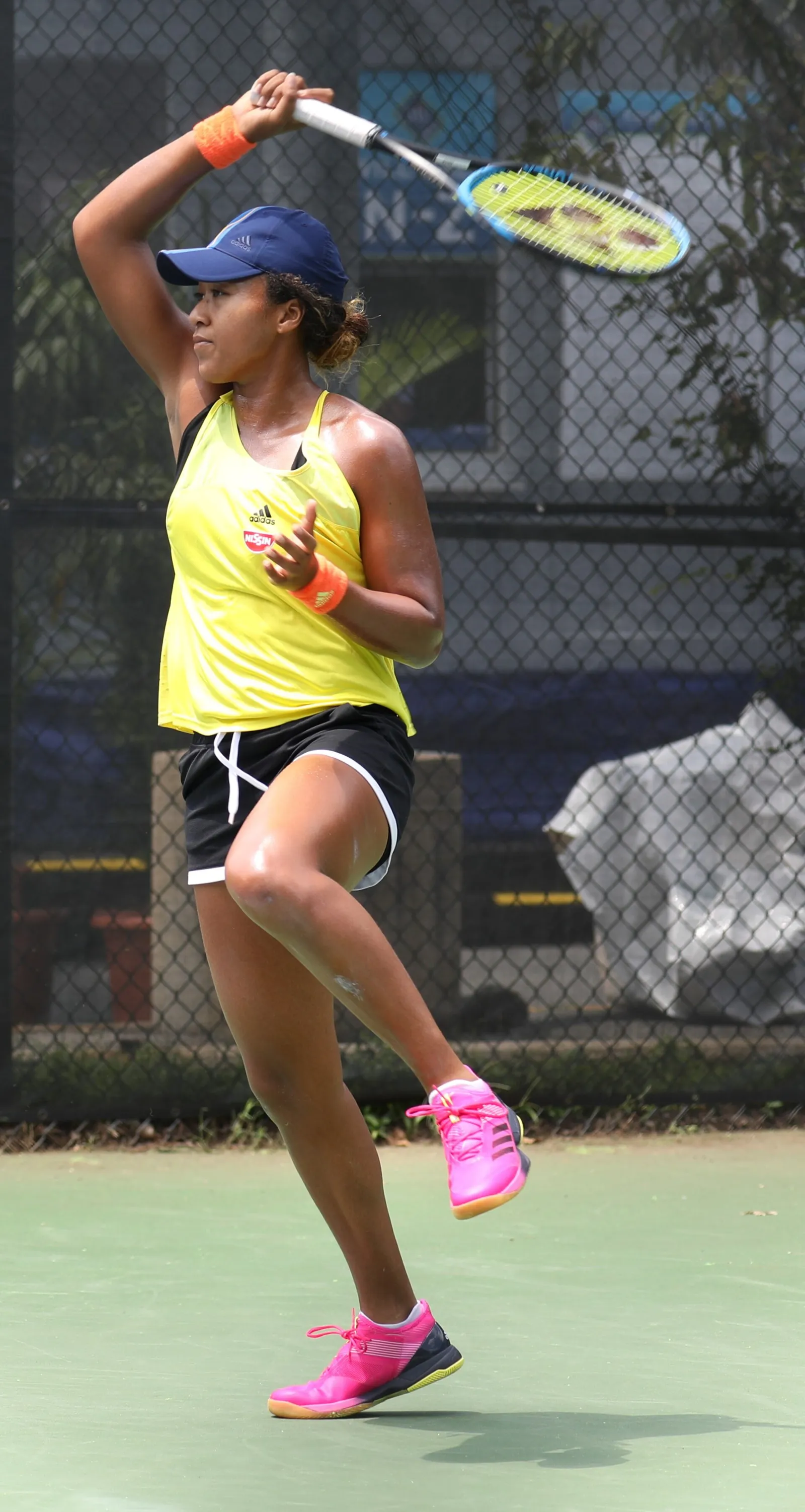 Naomi Osaka playing a shot